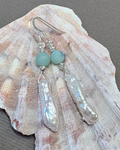 Pearl and silver earrings with green agate beads on a shell 
