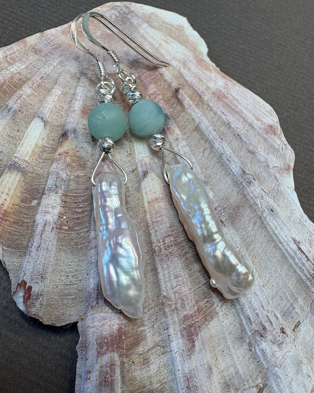 Natural pearl and silver earrings with green agate beads  on a shell